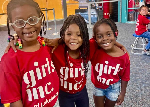 three girls smiling